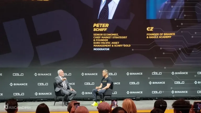 CZ vs Schiff on stage during a live debate at Binance Blockchain Week.